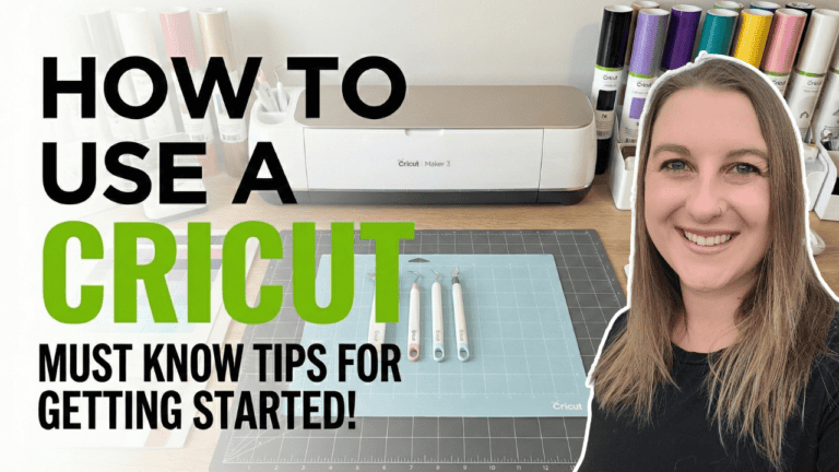 YouTube thumbnail showing Kerri Adamczyk smiling next to a white and champagne Cricut Maker 3 machine on a wooden desk. Light blue Cricut cutting mat with weeding tools displayed in front. Colorful Cricut vinyl rolls visible on shelves in background. Clean, bright craft room setting. Text overlay reads "How to Use a Cricut - Must Know Tips for Getting Started!" with "Cricut" in bold green lettering.