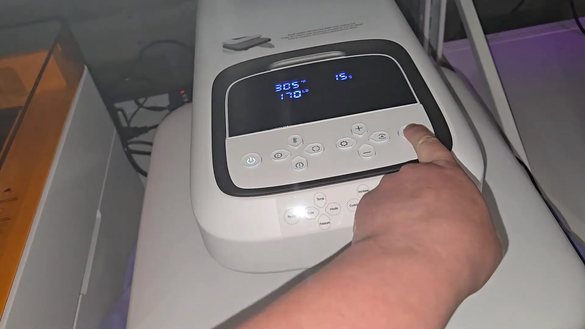 Heat pressing iron-on vinyl onto sweatshirt