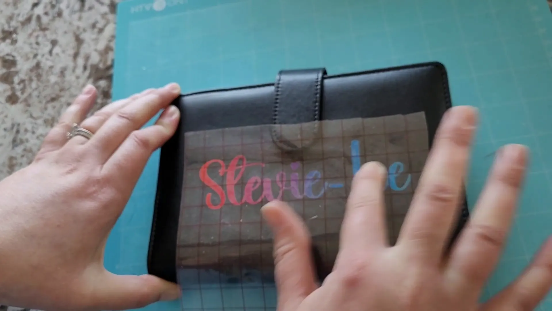 Personalizing Budget Binders with Vinyl and Cricut: Easy DIY Tutorial 10 Applying vinyl design to budget binder using transfer tape