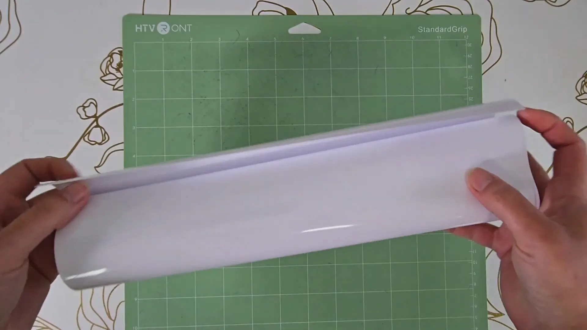 Materials laid out for iron-on vinyl shirt project