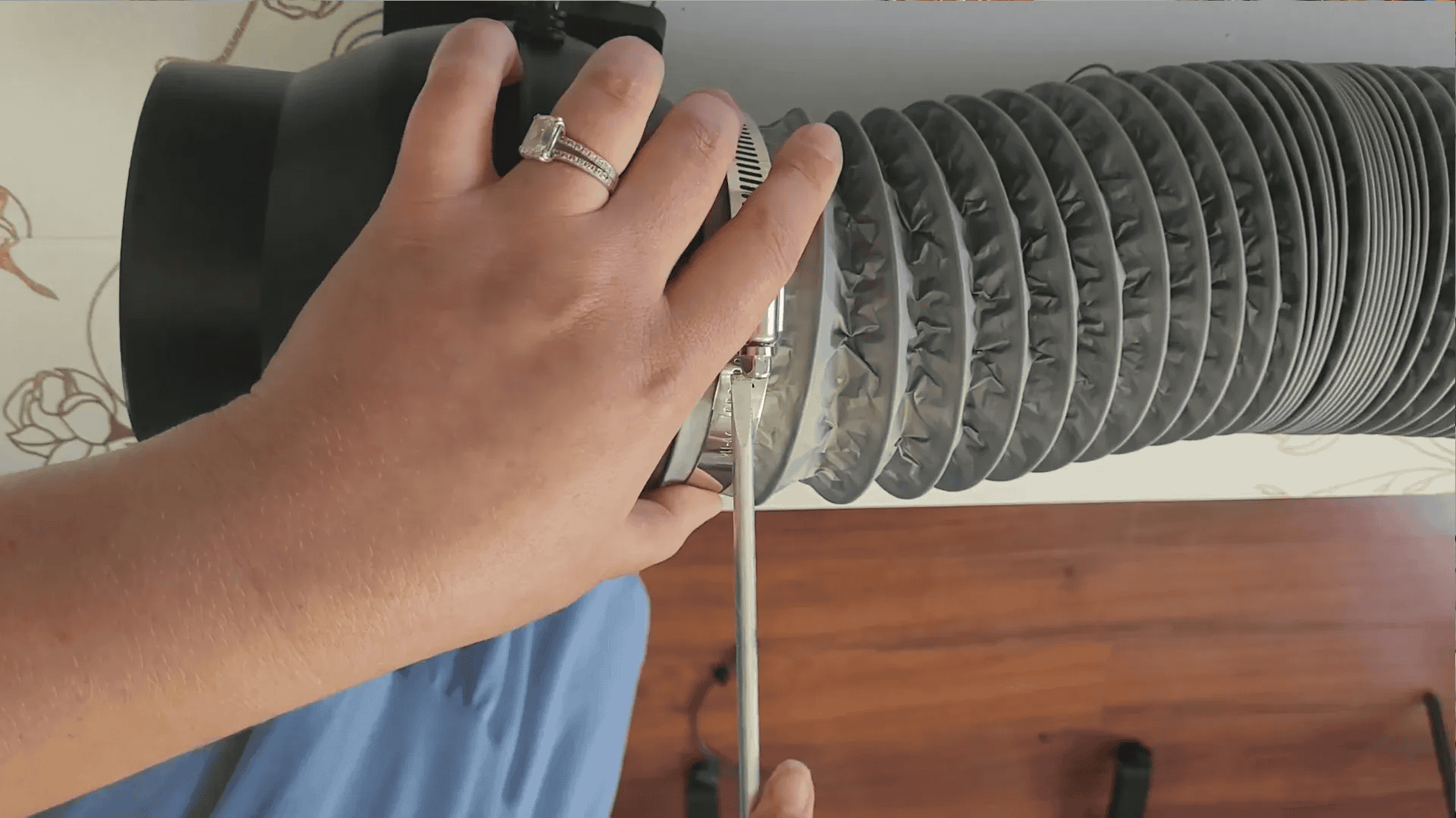 Connecting hoses and clamps to booster fan