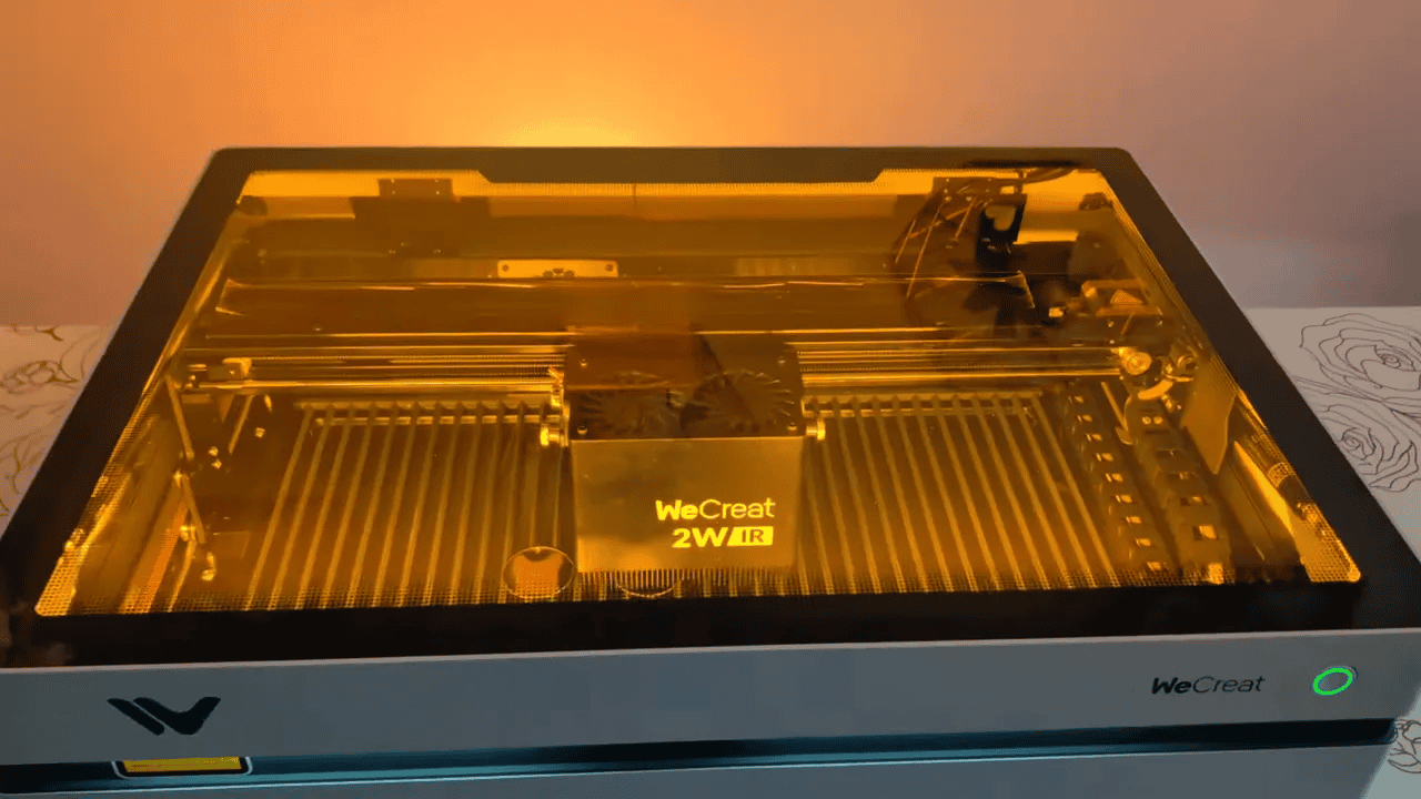 WeCreat Vista 2W IR laser on a workbench showing compact white design