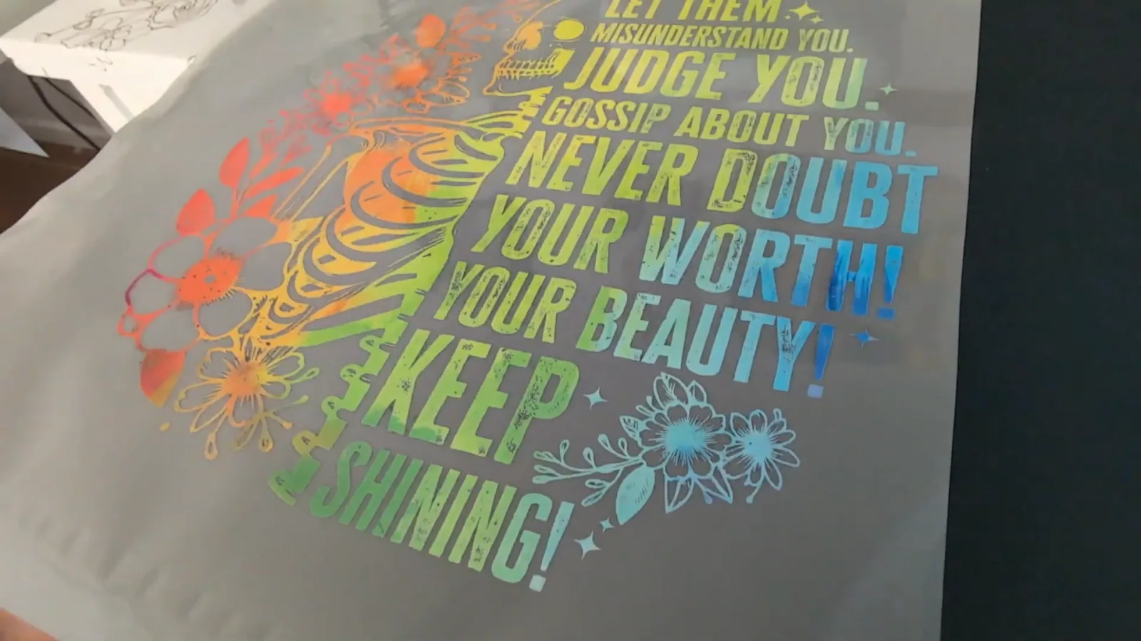 Close up of a vibrant multicolor DTF design pressed onto a cotton t-shirt