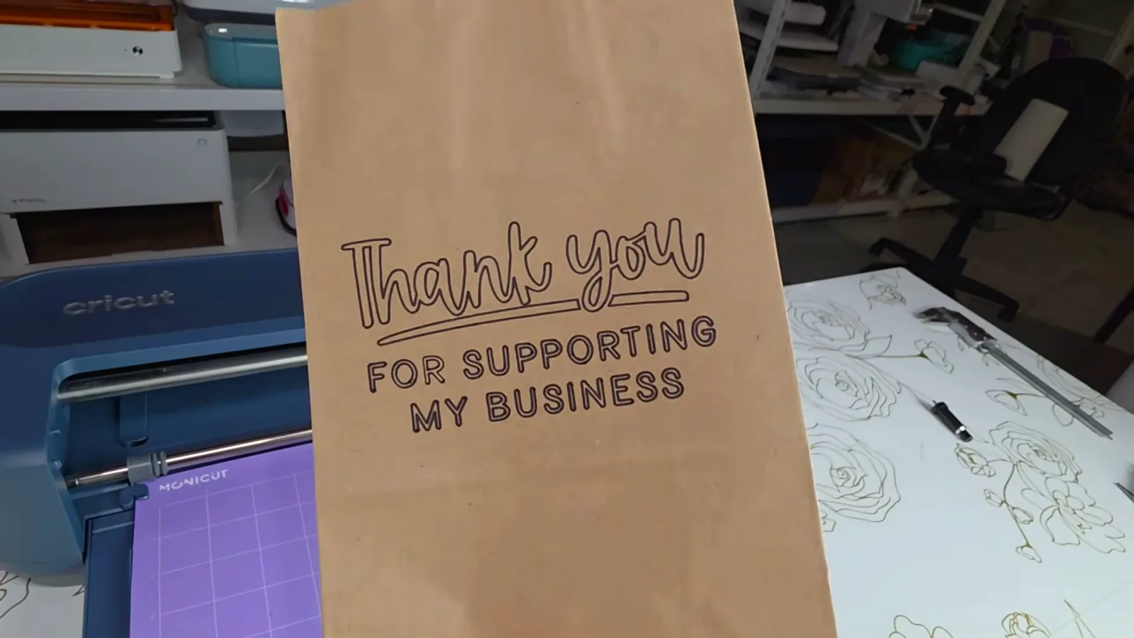 Kraft paper gift bag reading Thank you for supporting my business, drawn with a Cricut Maker 5 marker