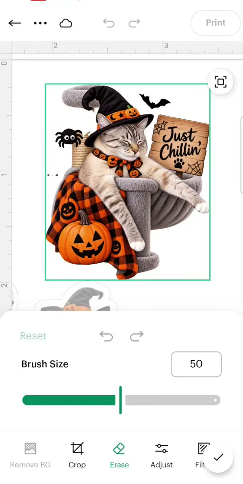 Using the eraser tool in Cricut Design Space to clean up a Halloween cat sticker