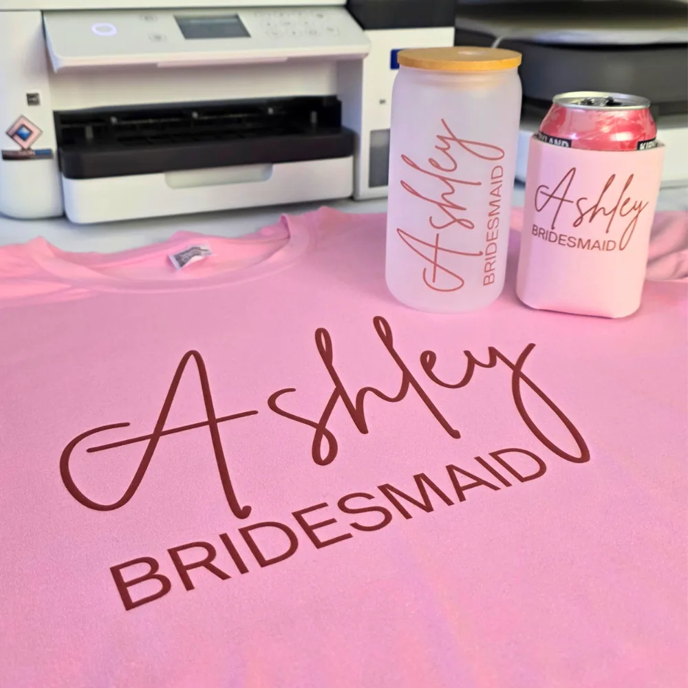 Wedding Sublimation Ideas: 3 Personalized Name Projects That Sell 3 Matching personalized bridesmaid set: pink polyester shirt, frosted glass can and neoprene can cooler with the same name design