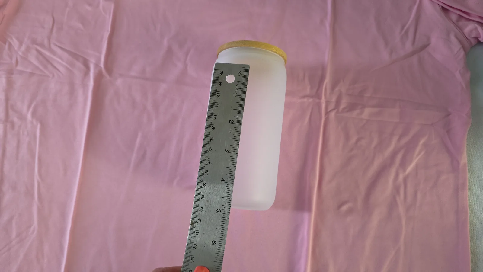 Wedding Sublimation Ideas: 3 Personalized Name Projects That Sell 6 Measuring a 16 oz frosted sublimation glass can with a ruler before designing in Canva