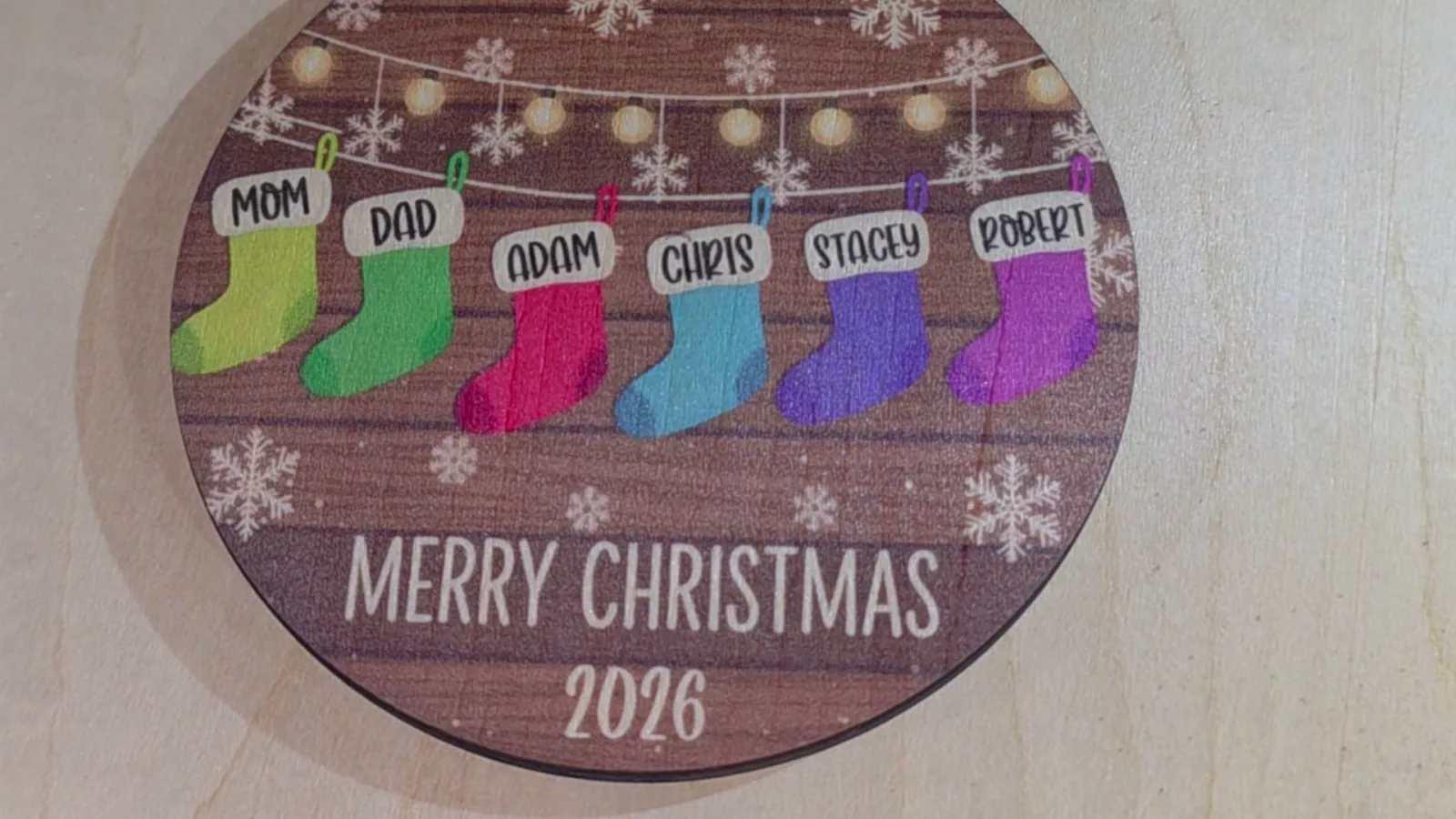 Close-up of a print on basswood coated with clear inkAID showing sharp lettering and bright stocking colors