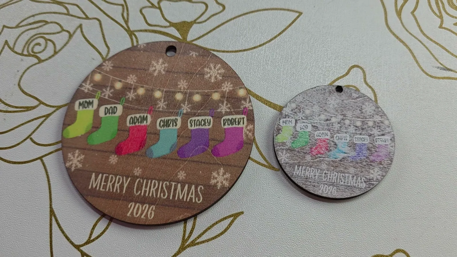 Ornament printed on white spray painted basswood with the xTool M2 next to a bare basswood print, showing splotchy colors