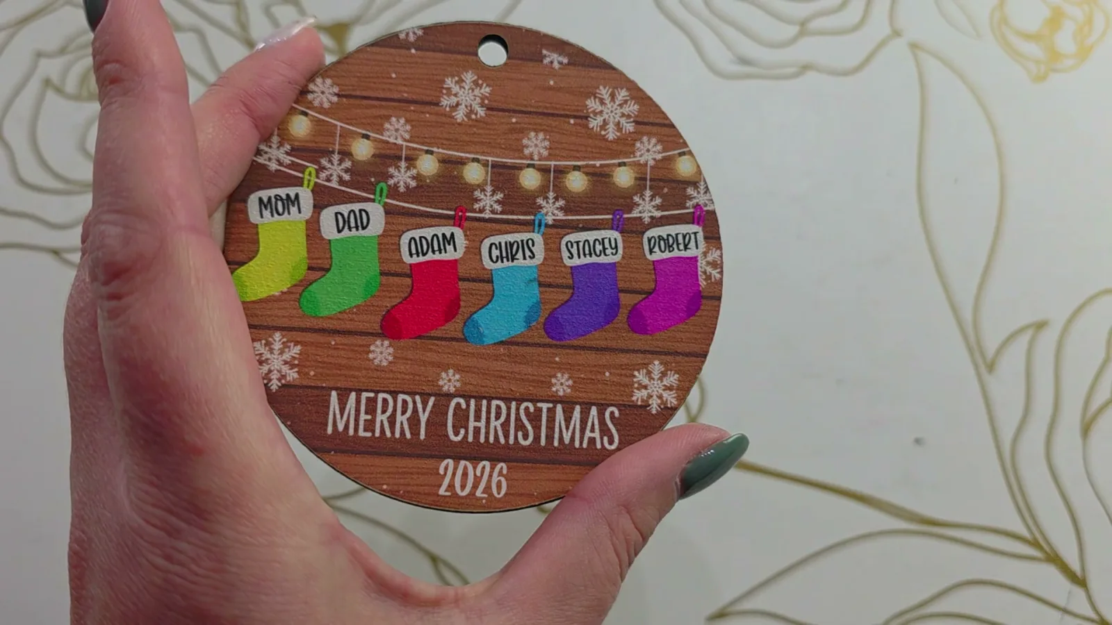 Personalized family Christmas ornament printed on basswood coated with white inkAID using the xTool M2, with bright colors and sharp names